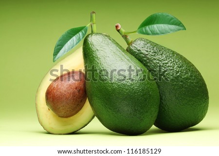 Avocado isolated on a green background.