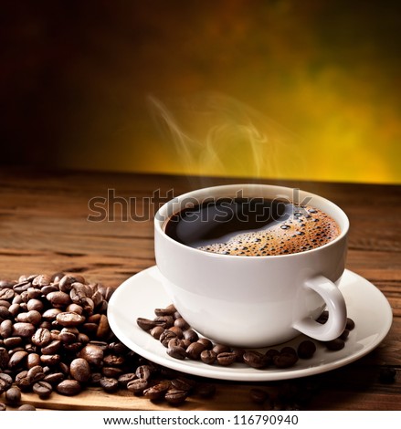 Coffee Cup And Saucer On A Wooden Table. Dark Background.
