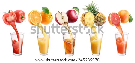 Fresh juice pours from fruits and vegetables in a glass. Clipping path. On a white background.