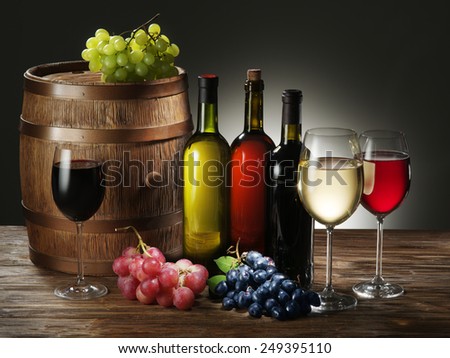 Still-life with wine, cheeses and fruits.