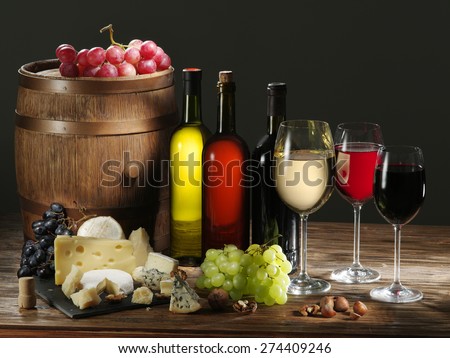 Still-life with wine cheeses and fruits.