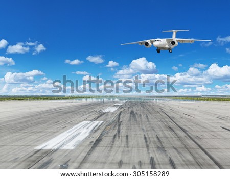 Passenger airplane landing on runway in airport.