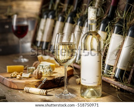 Wine bottles on the wooden shelf. Vintage wine.
