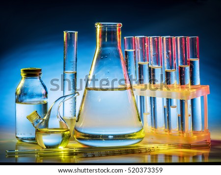 Different laboratory beakers and glassware. Multicolored.