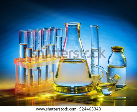 Different laboratory beakers and glassware. Multicolored.