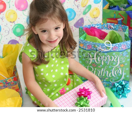 stock-photo-little-girl-waiting-to-open-her-birthday-present-2531810.jpg