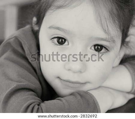 close black and white portrait - some background grain - little girl with big eyes