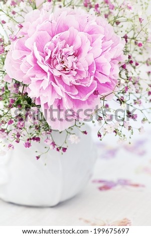 floral composition with a peony flower on a light background