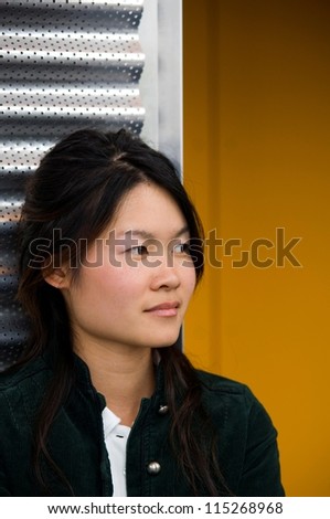 Portrait of an Asian college student looking away