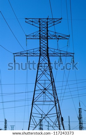 Low angle view on a transmission towers and power lines