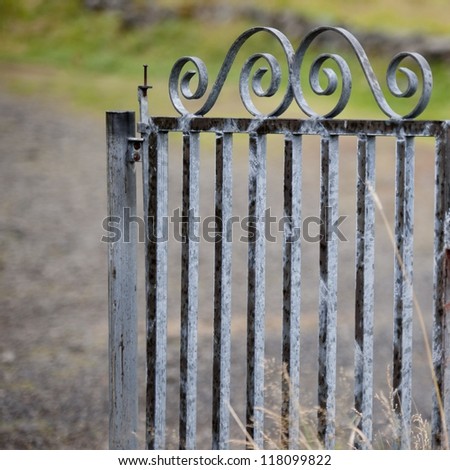 Wrought iron gate on rural lane