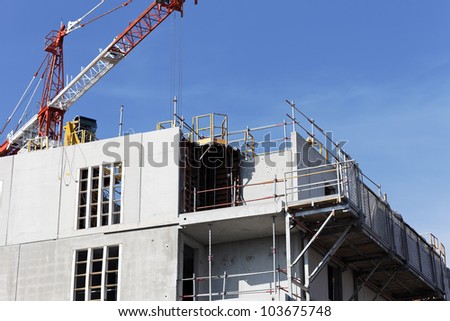 Construction site with crane in blue sky