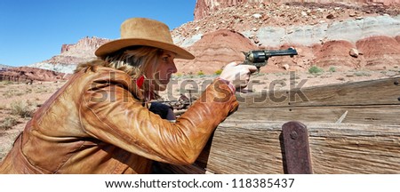 cowgirl with a gun in the hand, western spirit