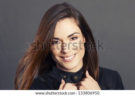 Glamour portrait of woman model with hair in the wind