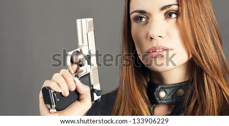 woman holding up her weapon