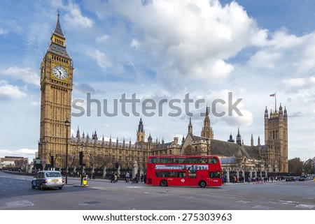 LONDON - APRIL 12: London Bus with Big Ben on April 12, 2015 in London, England. The London Bus service is one of the largest urban bus networks in the world with 8,000 buses covering 700 routes.