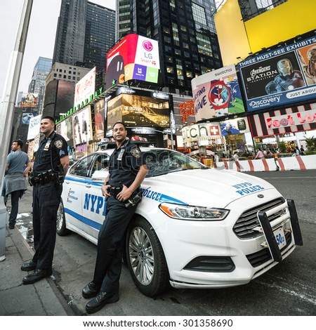 NEW YORK CITY - JULY 10: NYPD Police officers in NYC on July 10, 2015. The New York City Police Department (NYPD), established in 1845, is the largest municipal police force in the United States.