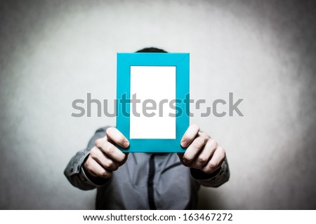 A young depressed man holding the picture frame, colored