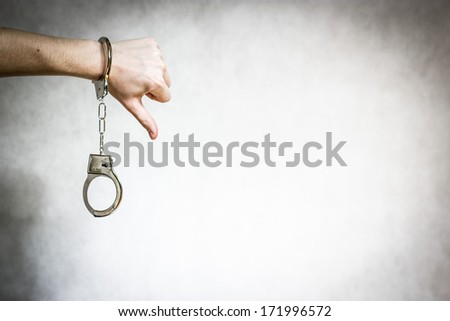 Thumb down with shackles