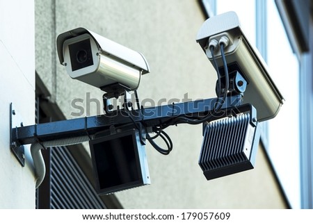 security cameras on the wall watching the street