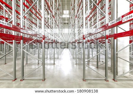 Empty warehouse interior with shelving system