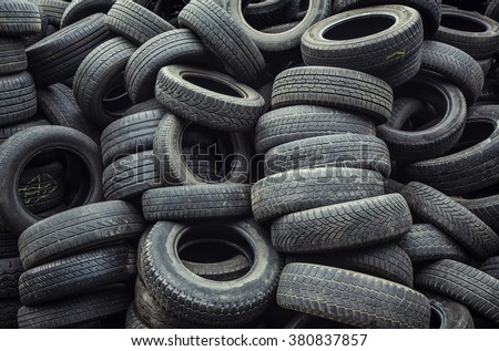 used car tires pile in the tire repair shop yard