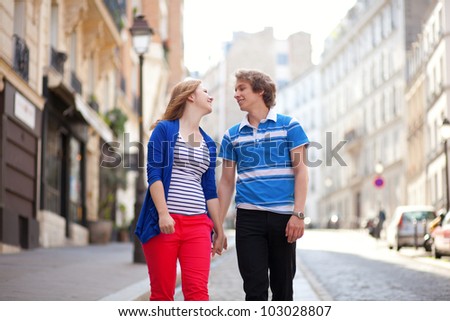 Dating couple walking together on Montmartre hill in Paris, France