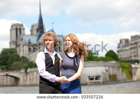 Young beautiful couple in Paris, enjoying their walk