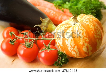 Vegetable background. Fresh tasty vegetables on the wooden table