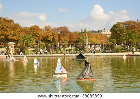 Toy boats in the Luxembourg Garden of Paris, France. Pirate boat is on the first plan