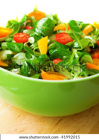Eat healthy! Fresh vegetable salad served in a green salad bowl