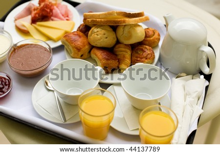 Tasty breakfast for two, closeup of the tray