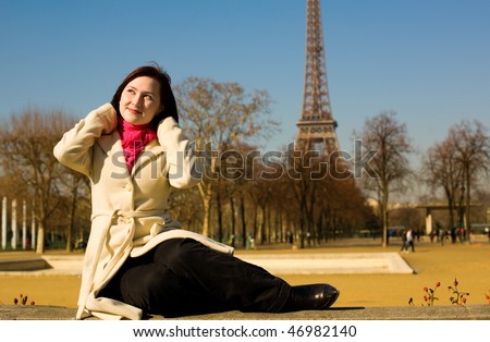 Happy beautiful woman in Paris in springtime