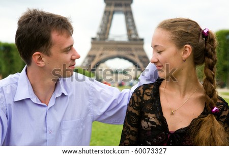 Couple in love in Paris near the Eiffel Tower