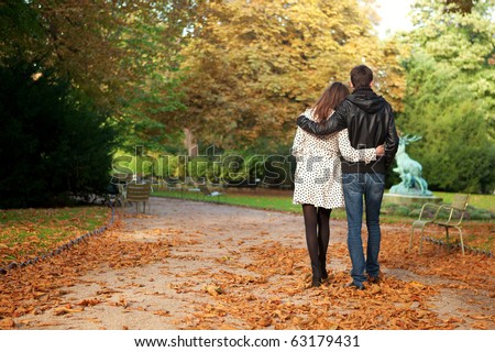 Young beautiful couple in the Luxembourg garden at fall. Paris, France