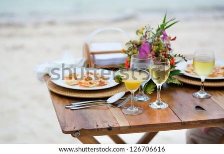 Romantic dinner served for two on a beach