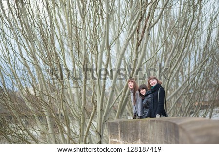 Three girls in Paris on a spring, winter or fall day