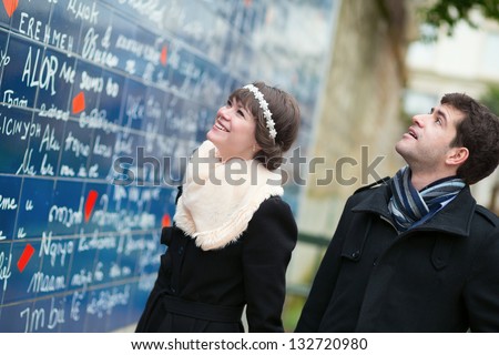 Couple near the I Love You wall in Paris