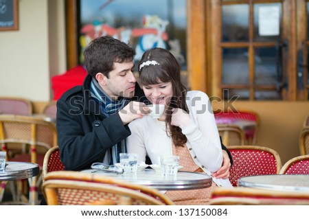 Couple drinking coffee in a cafe