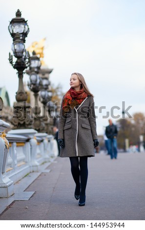 Beautiful girl walking in Paris
