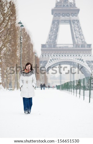 Girl walking in Paris on a winter day