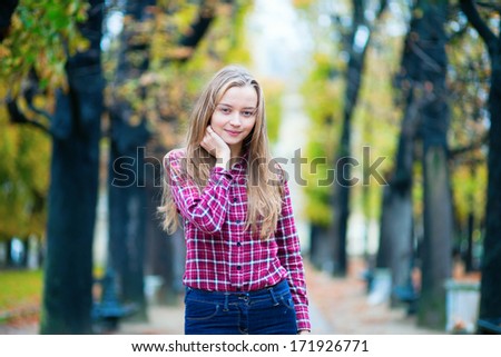 Pretty young girl in a fall or spring park
