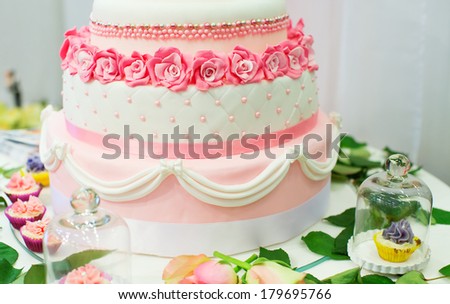 Wedding cake decorated with pink roses