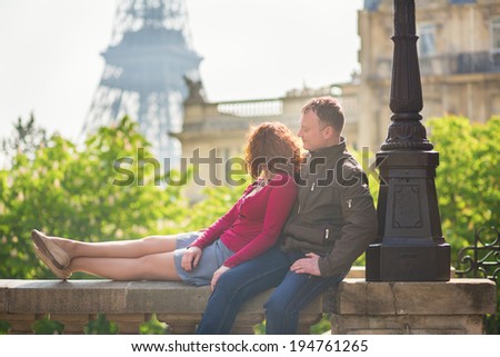 Romantic couple in Paris on a sunny day