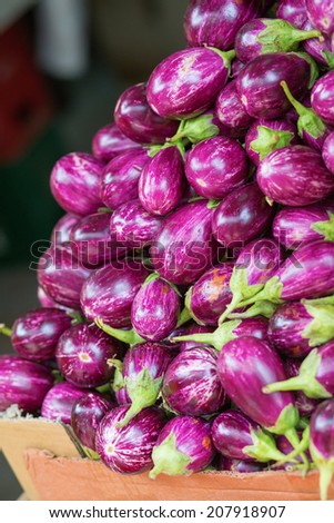 Pile of eggplants on market in Little India district, Singapore