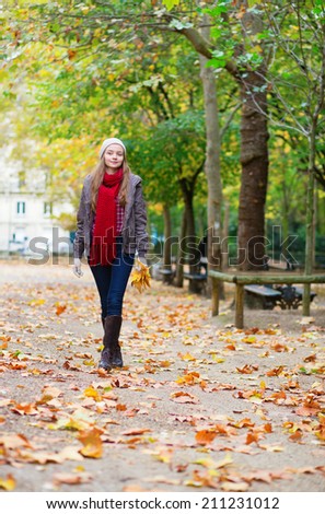 Girl walking in a park on a fall day