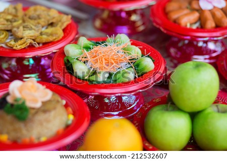 Food plates near the Chinese temple in Singapore, prepared for the believers
