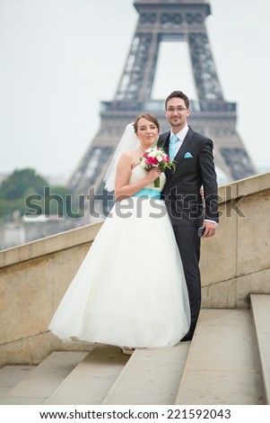 Happy just married couple near the Eiffel tower in Paris