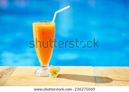 Delicious fresh mango juice near the pool on a tropical resort