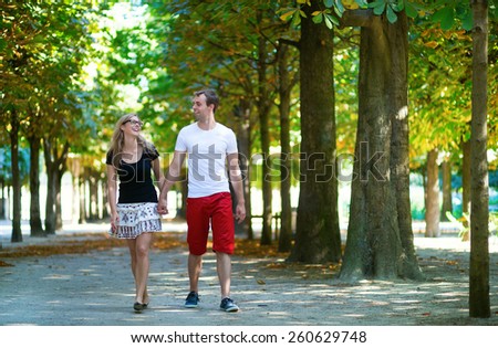 Couple walking in park on a summer or early fall day
